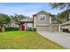 Charming home featuring a well-manicured lawn and a three-car garage at 600 Statenville Ct, Ocoee, FL 34761