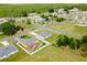 Aerial view of a modern home on a large lot in a serene, wooded neighborhood at 6164 Sw 129Th St, Ocala, FL 34473