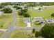 An aerial view of a lovely single-Gathering home with a well-manicured lawn and mature landscaping at 6164 Sw 129Th St, Ocala, FL 34473