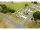 A high aerial view of a modern single Gathering home with green lawn and mature trees at 6164 Sw 129Th St, Ocala, FL 34473