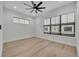 Bedroom featuring wood flooring and a large window at 62 W Jersey St # 13, Orlando, FL 32806