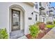 Stylish townhome entryway with a modern arched doorway and tiled floor at 62 W Jersey St # 13, Orlando, FL 32806