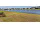 Scenic backyard overlooking a tranquil lake, providing a peaceful and picturesque setting at 6403 Shimmering Shores Ln, St Cloud, FL 34771