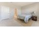 Bedroom with attached bath features a large window and neutral colors at 6403 Shimmering Shores Ln, St Cloud, FL 34771