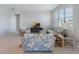 Inviting living room with floral sofa and chairs, a TV, and bright natural light at 6403 Shimmering Shores Ln, St Cloud, FL 34771