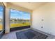 Screened patio overlooks the lake view. A large black rug adorns the brick floor at 6403 Shimmering Shores Ln, St Cloud, FL 34771