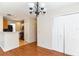 Open dining area view of kitchen, laminate floors, and pantry at 645 Stafford Ter # 162, Altamonte Springs, FL 32714