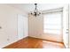 Cozy dining area features a chandelier, closet and a window providing natural light and charm at 645 Stafford Ter # 162, Altamonte Springs, FL 32714