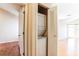 Hallway view of the laundry closet with a stacked washer and dryer at 645 Stafford Ter # 162, Altamonte Springs, FL 32714