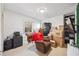 Functional room with neutral walls, packed boxes, a vintage desk, chair, and carpeted floor at 7279 Nena Ct, Mount Dora, FL 32757