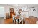 Charming dining room with wood floors, chandelier, and decorative hutch at 7279 Nena Ct, Mount Dora, FL 32757