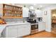 Bright kitchen with white cabinets, marble countertops, and stainless steel appliances at 7279 Nena Ct, Mount Dora, FL 32757