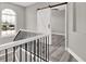 Stairway features a white barn door at the top of the stairs and iron spindles at 7548 Gathering Dr, Reunion, FL 34747