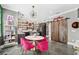 Eclectic dining area features a modern chandelier, kitchen view, with barn doors at 777 S Denning Dr # B, Winter Park, FL 32789