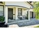 Welcoming front porch with stylish seating area and a charming entryway to the home at 777 S Denning Dr # B, Winter Park, FL 32789