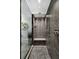 Luxurious walk-in shower featuring pebble tile floor and sleek gray tile surround at 777 S Denning Dr # B, Winter Park, FL 32789