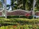 Entrance sign to Indian Lakes community surrounded by lush landscaping at 814 Chamberlin Trl, St Cloud, FL 34772