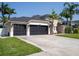 Spacious single-Gathering home with a three-car garage and well-manicured lawn at 814 Chamberlin Trl, St Cloud, FL 34772