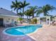 Lush backyard with a private pool, covered bar area, and ample seating at 814 Chamberlin Trl, St Cloud, FL 34772