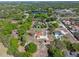 Overhead of home surrounded by trees, a nearby lake, and a green map pin denoting the house at 9272 Gotha Rd, Windermere, FL 34786