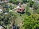 Aerial view of home with lush landscaping, spacious yard, and mature trees, offering an inviting outdoor setting at 9272 Gotha Rd, Windermere, FL 34786