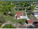 Aerial view of property highlighting a detached garage and mature trees, presenting a serene environment at 9272 Gotha Rd, Windermere, FL 34786