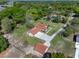 An aerial view showcases this home's lush, green surroundings and charming exterior at 9272 Gotha Rd, Windermere, FL 34786