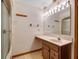 Well-lit bathroom featuring a shower-tub, vanity with sink, and mirrored wall for a refreshing experience at 9272 Gotha Rd, Windermere, FL 34786