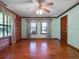 Bright bedroom with hardwood floors, large windows, and a ceiling fan at 9272 Gotha Rd, Windermere, FL 34786