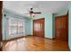 Sunny bedroom with hardwood floors, a window, and closet storage at 9272 Gotha Rd, Windermere, FL 34786