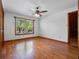 Bright bedroom with wood floors, a window, and a ceiling fan at 9272 Gotha Rd, Windermere, FL 34786