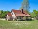 Daytime shot shows the home's siding, roof, windows, and covered porch entry at 9272 Gotha Rd, Windermere, FL 34786