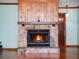 Close up of stone fireplace with wood mantel and hearth at 9272 Gotha Rd, Windermere, FL 34786