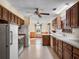 Bright kitchen featuring wood cabinets, white countertops, and ample storage space at 9272 Gotha Rd, Windermere, FL 34786