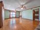 Spacious living room with hardwood floors, connecting to other living spaces at 9272 Gotha Rd, Windermere, FL 34786