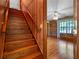 Wooden stairway leading to the second level, with a view into a bedroom at 9272 Gotha Rd, Windermere, FL 34786