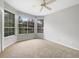 Bedroom featuring carpeted floor and big windows at 9700 Sw 194Th Cir, Dunnellon, FL 34432