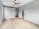 Carpeted bedroom with ceiling fan and a view to hallway and closet at 9700 Sw 194Th Cir, Dunnellon, FL 34432