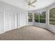 Bright bedroom with double closets, plush carpeting and serene views from the large windows at 9700 Sw 194Th Cir, Dunnellon, FL 34432