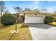 Charming single-story home features a two-car garage, well-maintained lawn, and inviting curb appeal at 9700 Sw 194Th Cir, Dunnellon, FL 34432