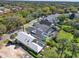 Scenic aerial view of homes in a community with mature trees and greenery throughout the neighborhood at 10148 Chiltern Garden Dr, Orlando, FL 32827