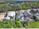 Overhead shot of homes with screened patios, swimming pools, and lush landscaping backing onto the golf course at 10148 Chiltern Garden Dr, Orlando, FL 32827