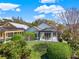 Beautiful backyard with a well-manicured lawn, mature landscaping and an outdoor seating area perfect for relaxing at 10148 Chiltern Garden Dr, Orlando, FL 32827