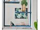 Dry bar features shelving decor with a pass-through to the dining area at 10148 Chiltern Garden Dr, Orlando, FL 32827