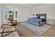 Comfortable bedroom with a bay window, plush bedding, and ample natural light at 10148 Chiltern Garden Dr, Orlando, FL 32827