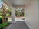 A view from the covered portico, showcasing the brick paver walkway at 10148 Chiltern Garden Dr, Orlando, FL 32827