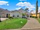 Charming single-Gathering home with a manicured lawn, stone accents, and a brick driveway at 10148 Chiltern Garden Dr, Orlando, FL 32827