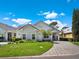 Beautiful home featuring a well-maintained lawn, stone details, and a brick driveway at 10148 Chiltern Garden Dr, Orlando, FL 32827