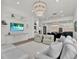 Open-concept living room features recessed lighting, neutral decor, and seamless flow to the kitchen at 10148 Chiltern Garden Dr, Orlando, FL 32827