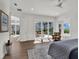 Main bedroom boasts outdoor access, neutral decor, and lots of natural light at 10148 Chiltern Garden Dr, Orlando, FL 32827